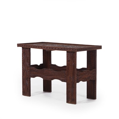 Lot 124 - A carved hardwood table