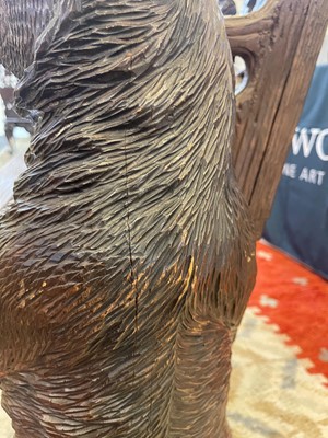 Lot 81 - A Black Forest carved linden wood bench