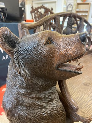 Lot 81 - A Black Forest carved linden wood bench