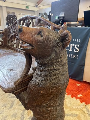 Lot 81 - A Black Forest carved linden wood bench