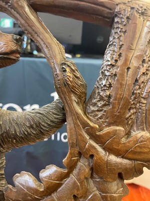 Lot 81 - A Black Forest carved linden wood bench