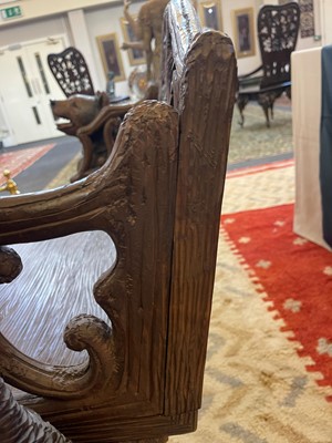 Lot 81 - A Black Forest carved linden wood bench