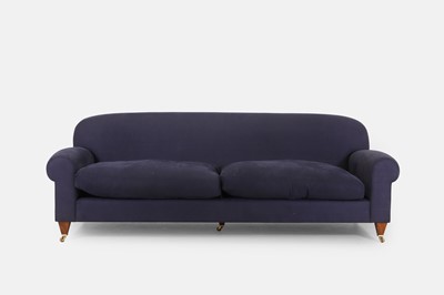 Lot 254 - An upholstered three-seater sofa