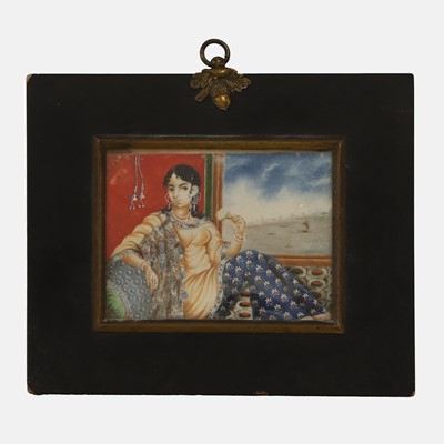Lot 255 - An Indian ivory portrait miniature of a reclined courtly lady