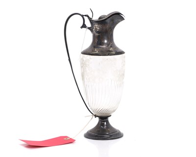 Lot 29 - A silver mounted cut glass claret jug