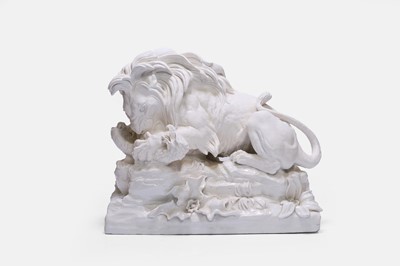 Lot 320 - A white-glazed pottery lion