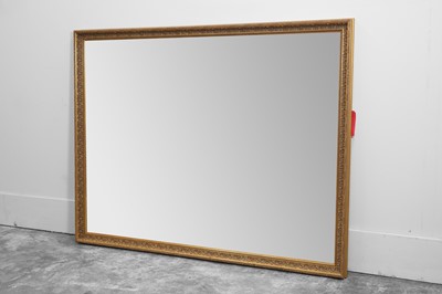 Lot 517 - A large modern giltwood rectangular wall mirror