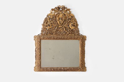 Lot 179 - A rococo carved giltwood and gesso wall mirror