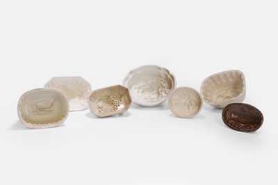 Lot 201 - A large collection of pottery jelly moulds