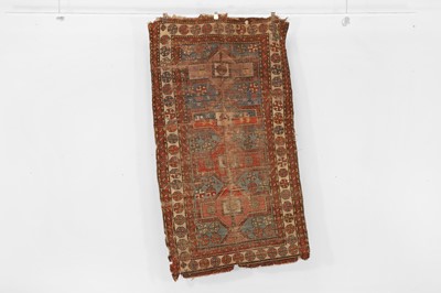 Lot 79 - A tribal wool rug