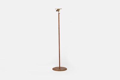 Lot 89 - A rattan and brass floor lamp