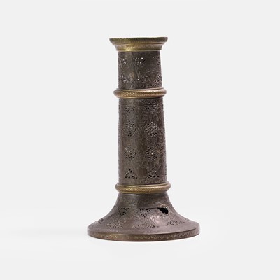 Lot 63 - A Qajar openwork brass 'mash’al' torch stand
