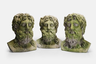 Lot 506 - A group of three composite stone busts of Zeus