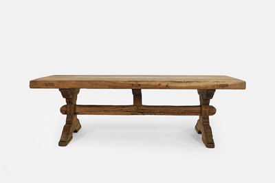Lot 517 - A farmhouse oak trestle table