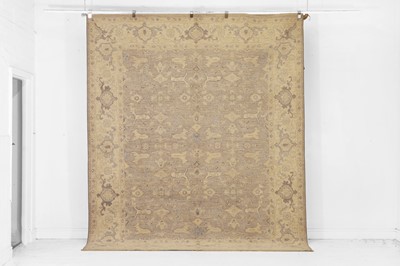 Lot 214 - An Oushak wool carpet