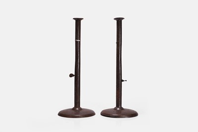 Lot 108 - A pair of 'hogscraper' sheet-iron ejector candlesticks