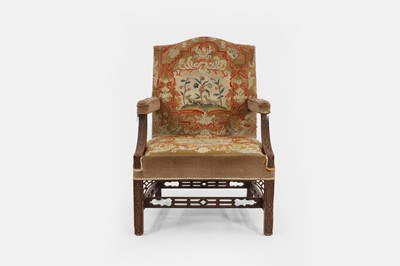 Lot 92 - A George III-style mahogany Gainsborough library armchair
