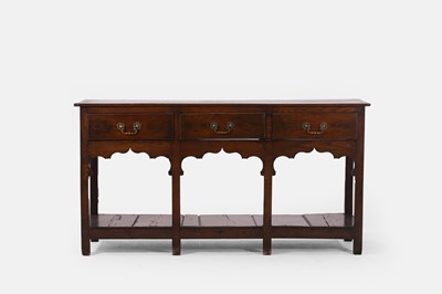 Lot 120 - A small George III oak dresser base