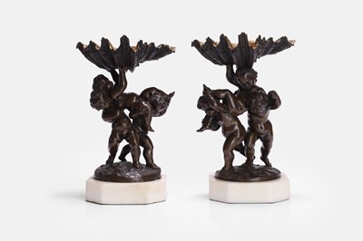 Lot 650 - A pair of patinated bronze tazzas in the manner of Clodion