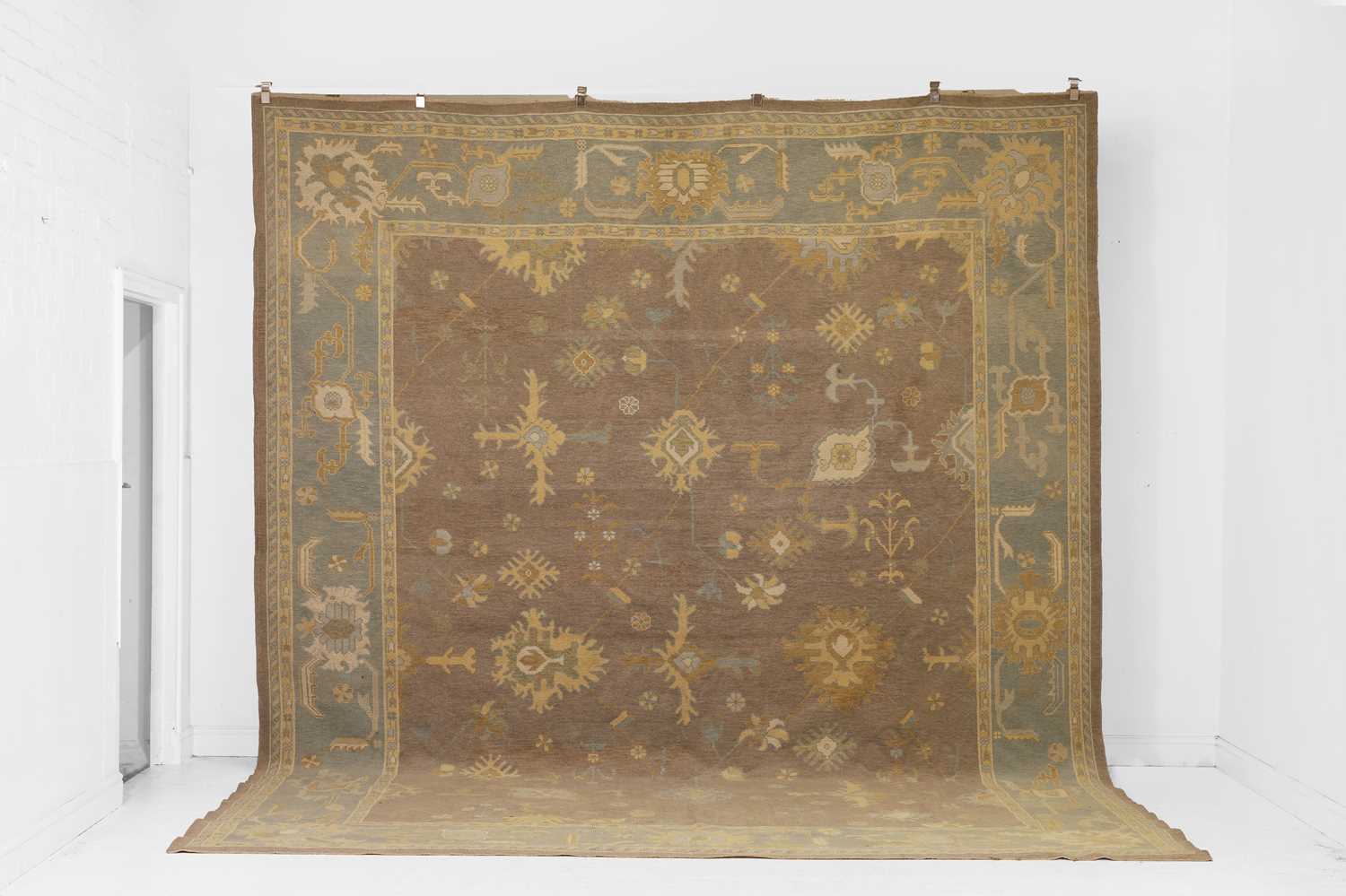 Lot 64 - An Oushak wool carpet