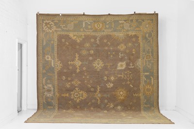 Lot 64 - An Oushak wool carpet