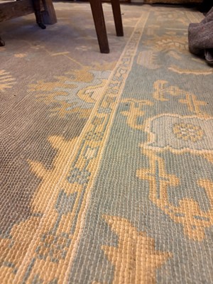 Lot 64 - An Oushak wool carpet