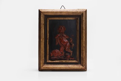Lot 312 - A red wax relief of a young faun playing the pipes