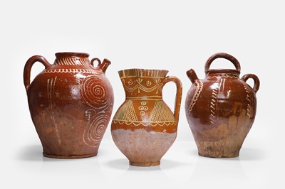 Lot 275 - Two glazed terracotta jugs