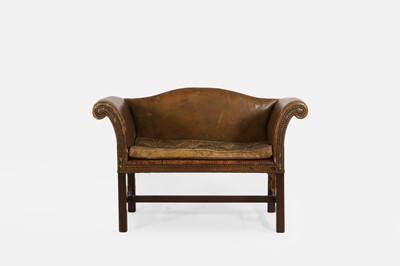 Lot 498 - A small leather-upholstered camelback sofa