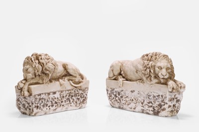 Lot 624 - A pair of alabaster lion bookends