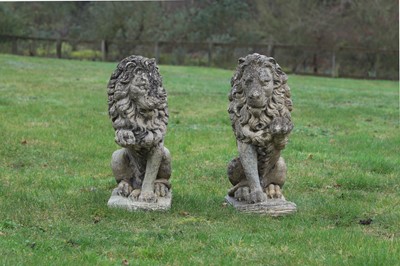 Lot 696 - A pair of reconstituted stone lions