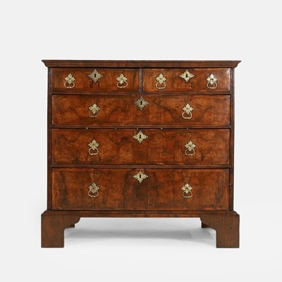Lot 533 - A walnut and feather-banded chest of drawers