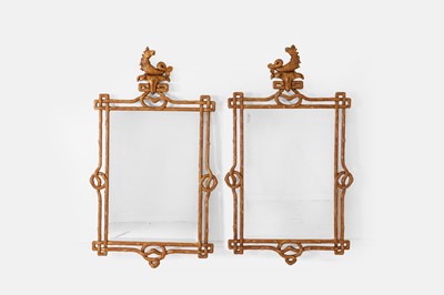 Lot 170 - A pair of Rococo-style carved giltwood faux bois wall mirrors