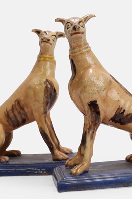 Lot 96 - A pair of faience greyhound figures