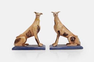 Lot 96 - A pair of faience greyhound figures