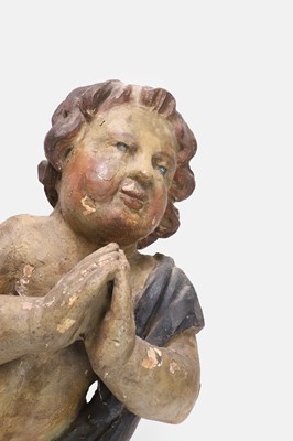 Lot 90 - A carved wooden putto