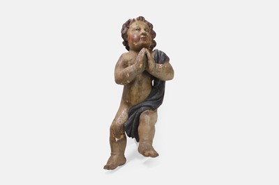 Lot 90 - A carved wooden putto