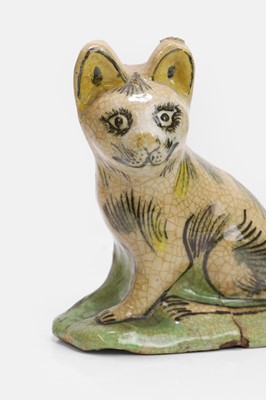 Lot 107 - A glazed pottery figure of a cat