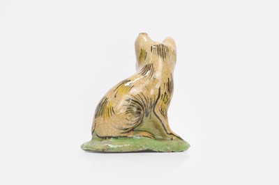 Lot 107 - A glazed pottery figure of a cat