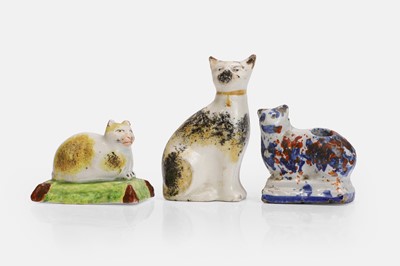 Lot 105 - Three Staffordshire cat figures