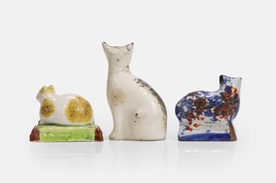 Lot 105 - Three Staffordshire cat figures