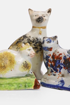 Lot 105 - Three Staffordshire cat figures