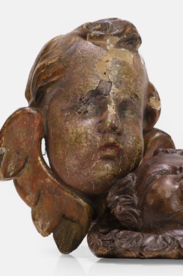 Lot 100 - Two carved wood putti heads