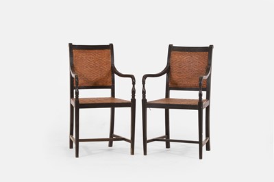 Lot 366 - A pair of stained wooden elbow chairs in the Anglo-Indian style