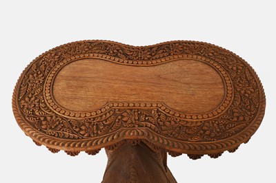 Lot 96 - A pair of teak camel occasional tables