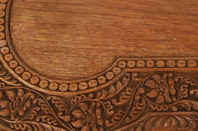 Lot 96 - A pair of teak camel occasional tables