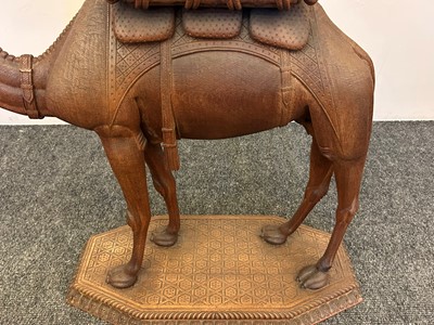 Lot 96 - A pair of teak camel occasional tables