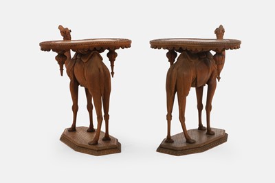 Lot 96 - A pair of teak camel occasional tables