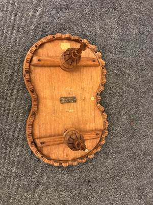 Lot 96 - A pair of teak camel occasional tables