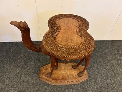 Lot 96 - A pair of teak camel occasional tables